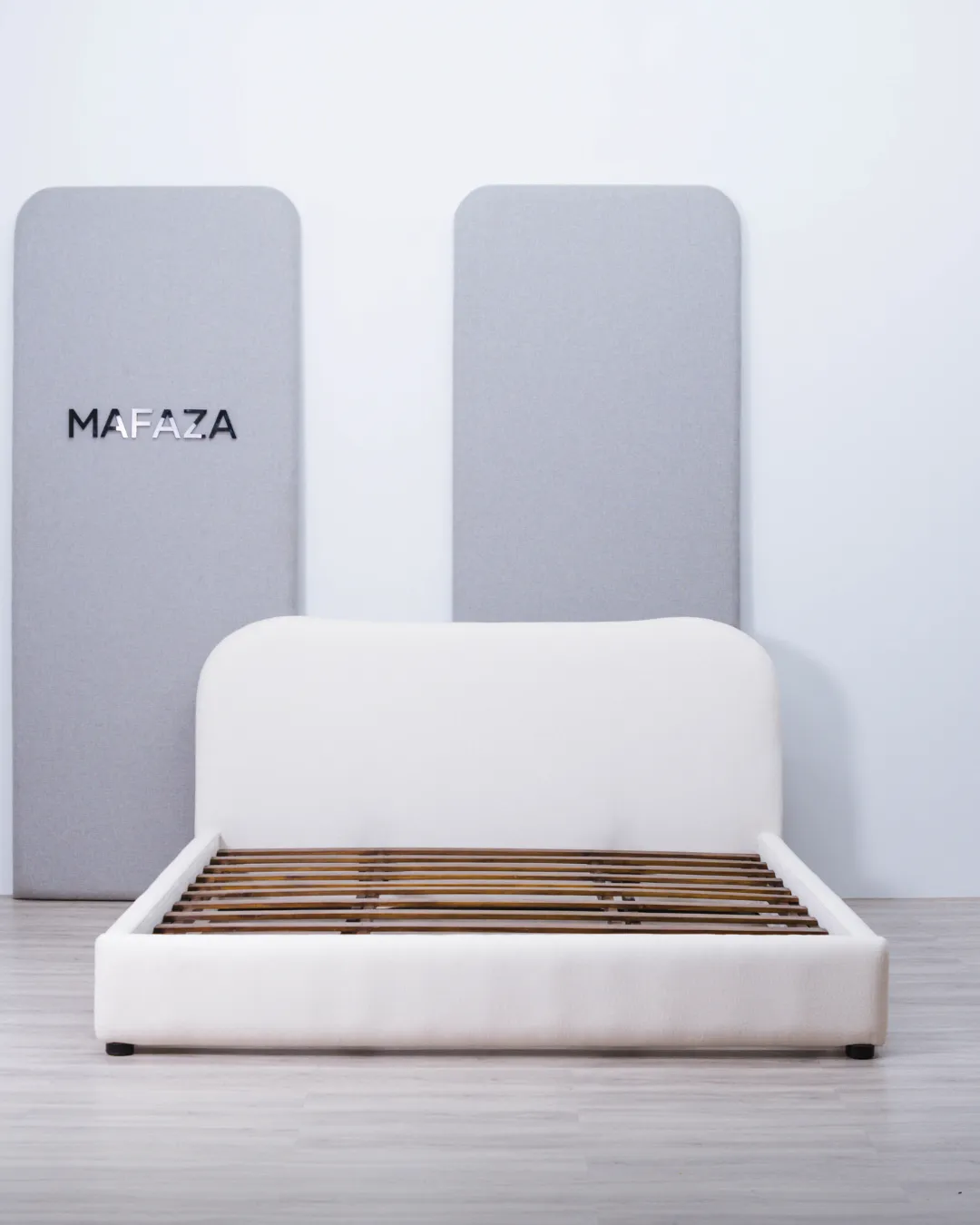 Elegant Diana Bed Frame for 180x200 mattress, crafted from solid teak wood featuring a tall, deep headboard upholstered in premium Millie Hikaron fabric.