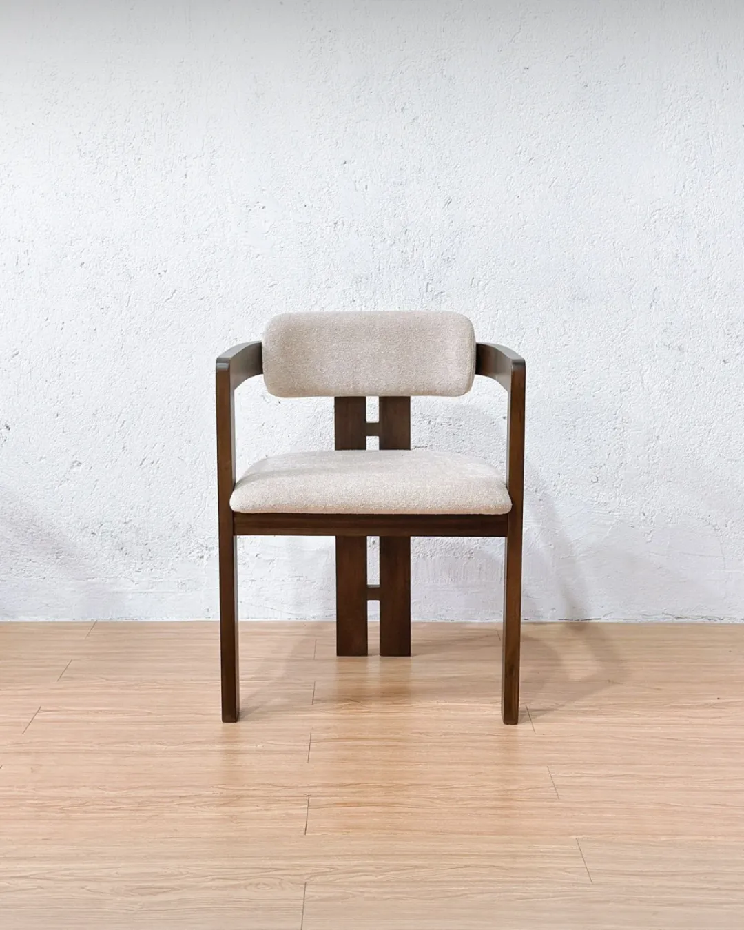 Evie dining chair featuring a modern teak wood frame