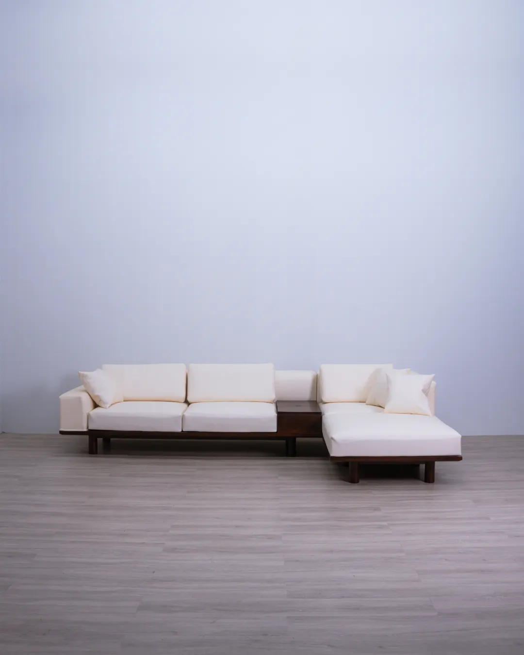 Large Maxi L-shaped sectional sofa (300cm) made of light chestnut teak wood, featuring synthetic leather upholstery and hidden 2-door storage drawers that double as a built-in table.