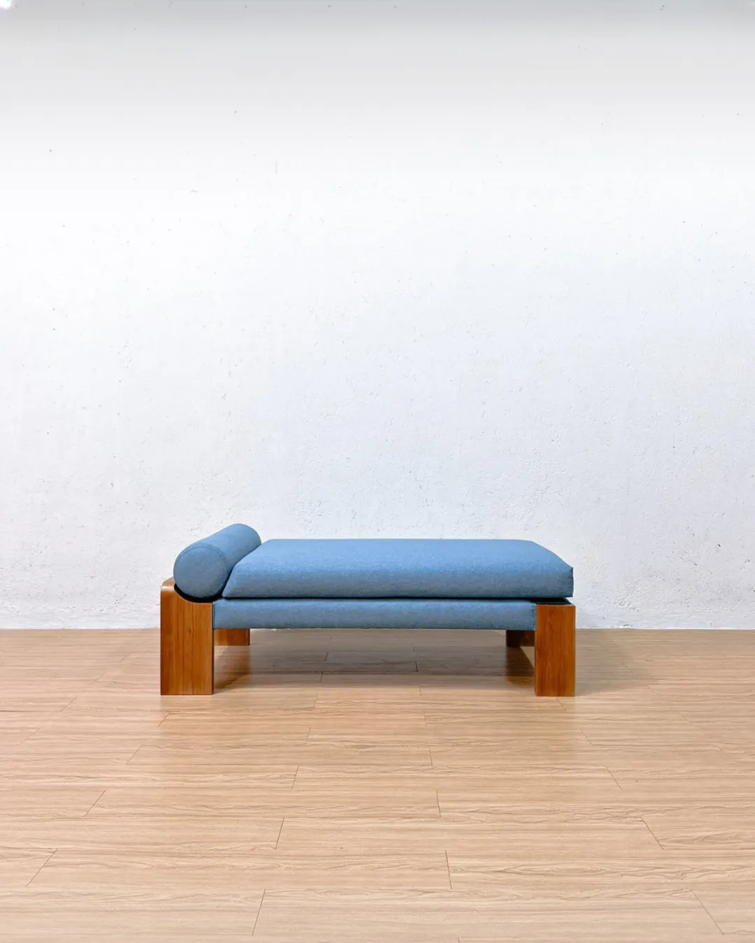 Olivier upholstered bench with teak wood base and modern cushion design