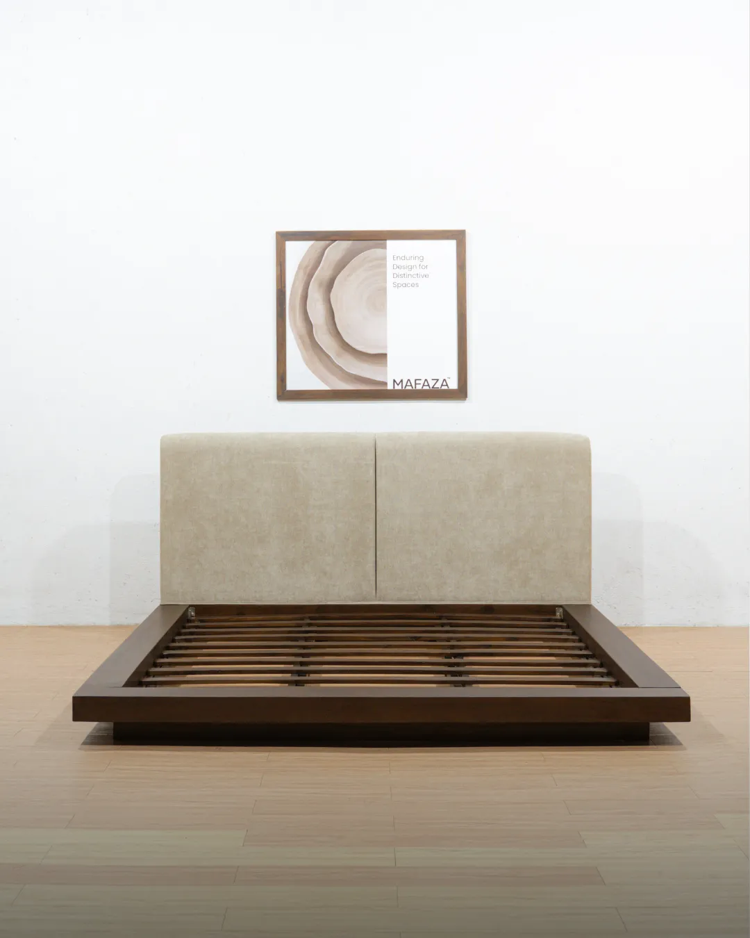 Worth Bed Frame (180x200) crafted from dark certified teak wood with a low, floating platform design and a large, upholstered beige headboard split into two vertical panels.