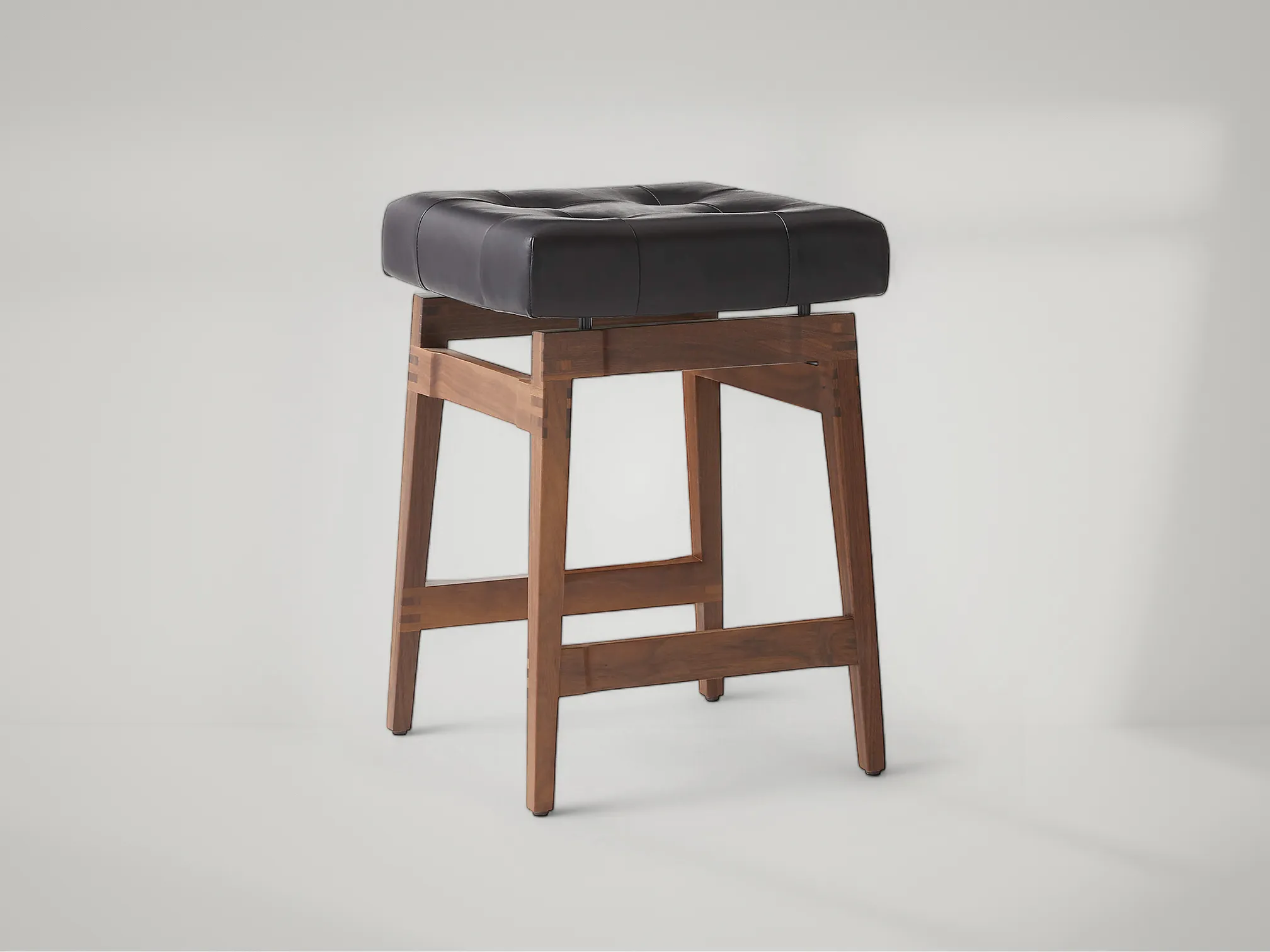 Briosco bar stool in solid teak with sculpted lines and modern stance by Mafaza Living