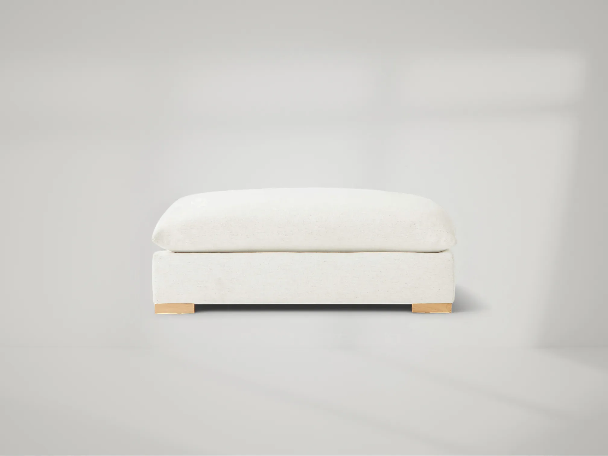 Deseo Ottoman – Modern ottoman with clean lines and teak base, matching the Deseo collection by Mafaza Living