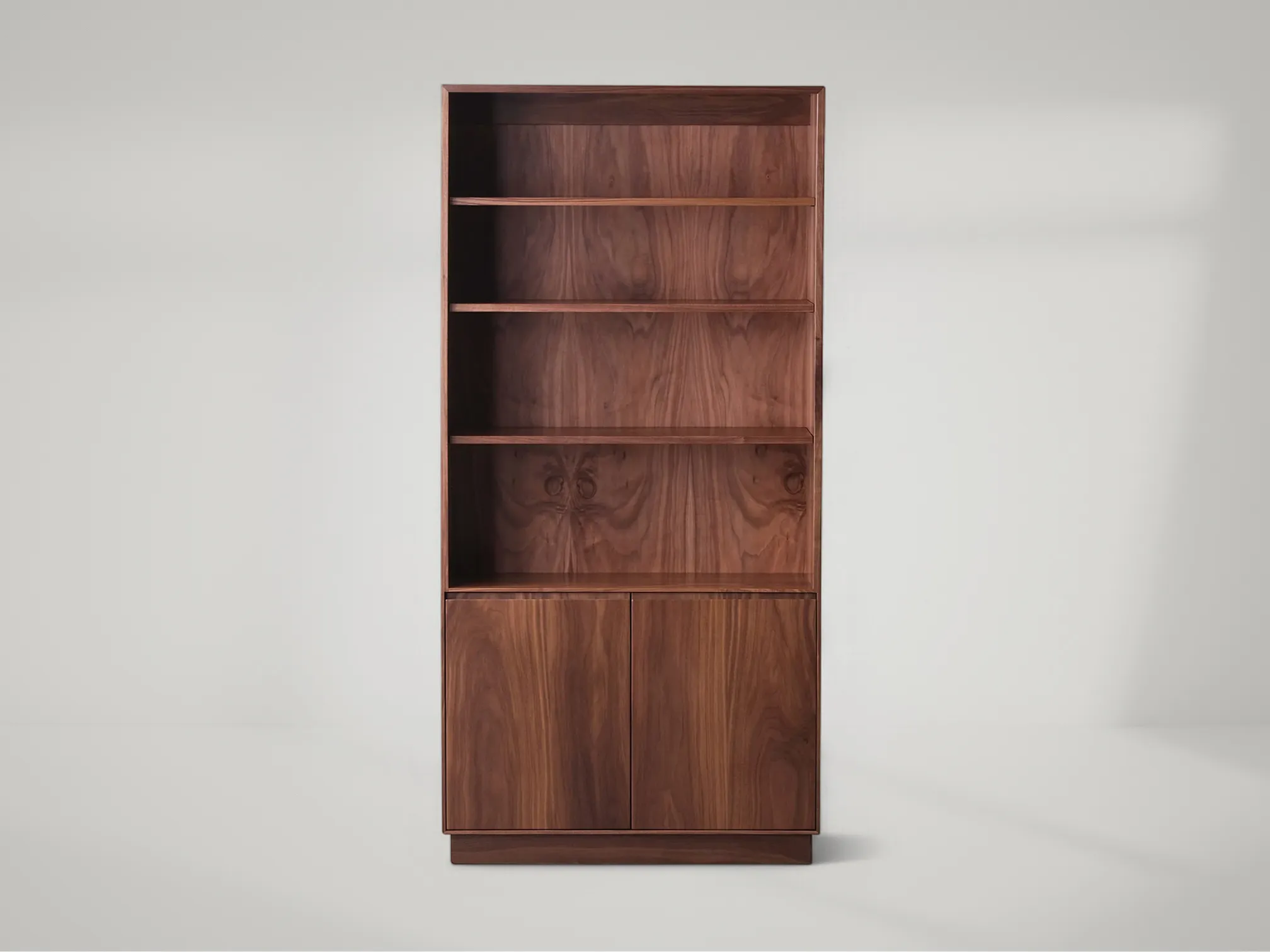 Douglas tall teak bookcase with vertical silhouette and handcrafted detailing by Mafaza Living