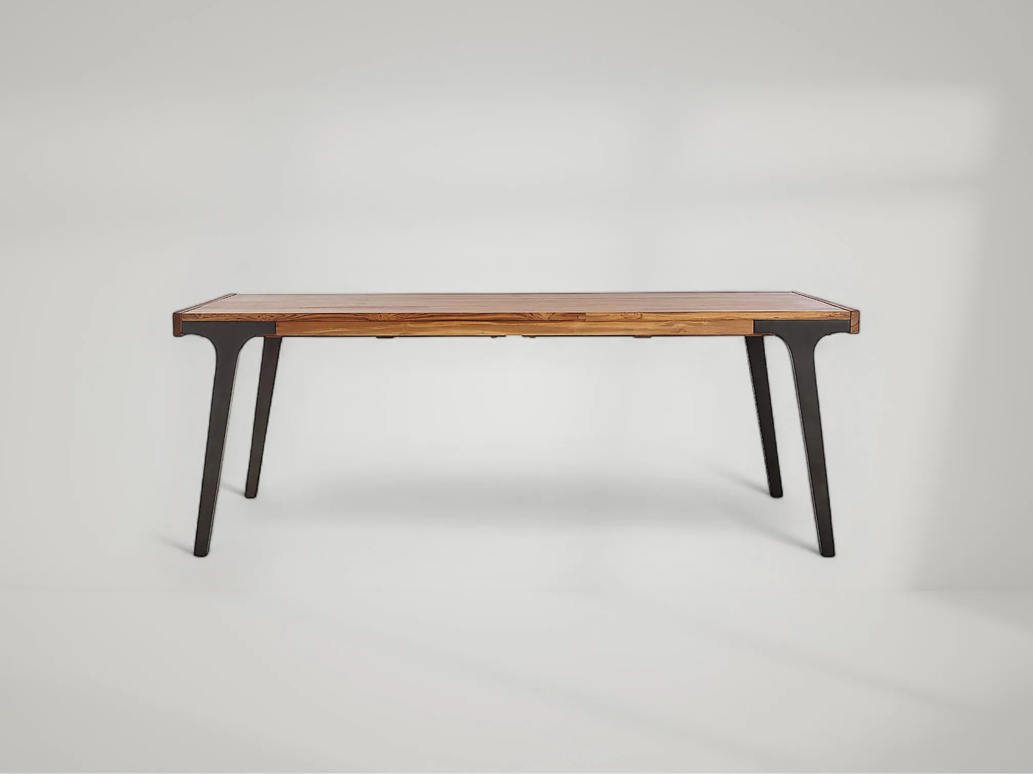 Lakin teak dining table with sleek silhouette and smooth handcrafted finish by Mafaza Living