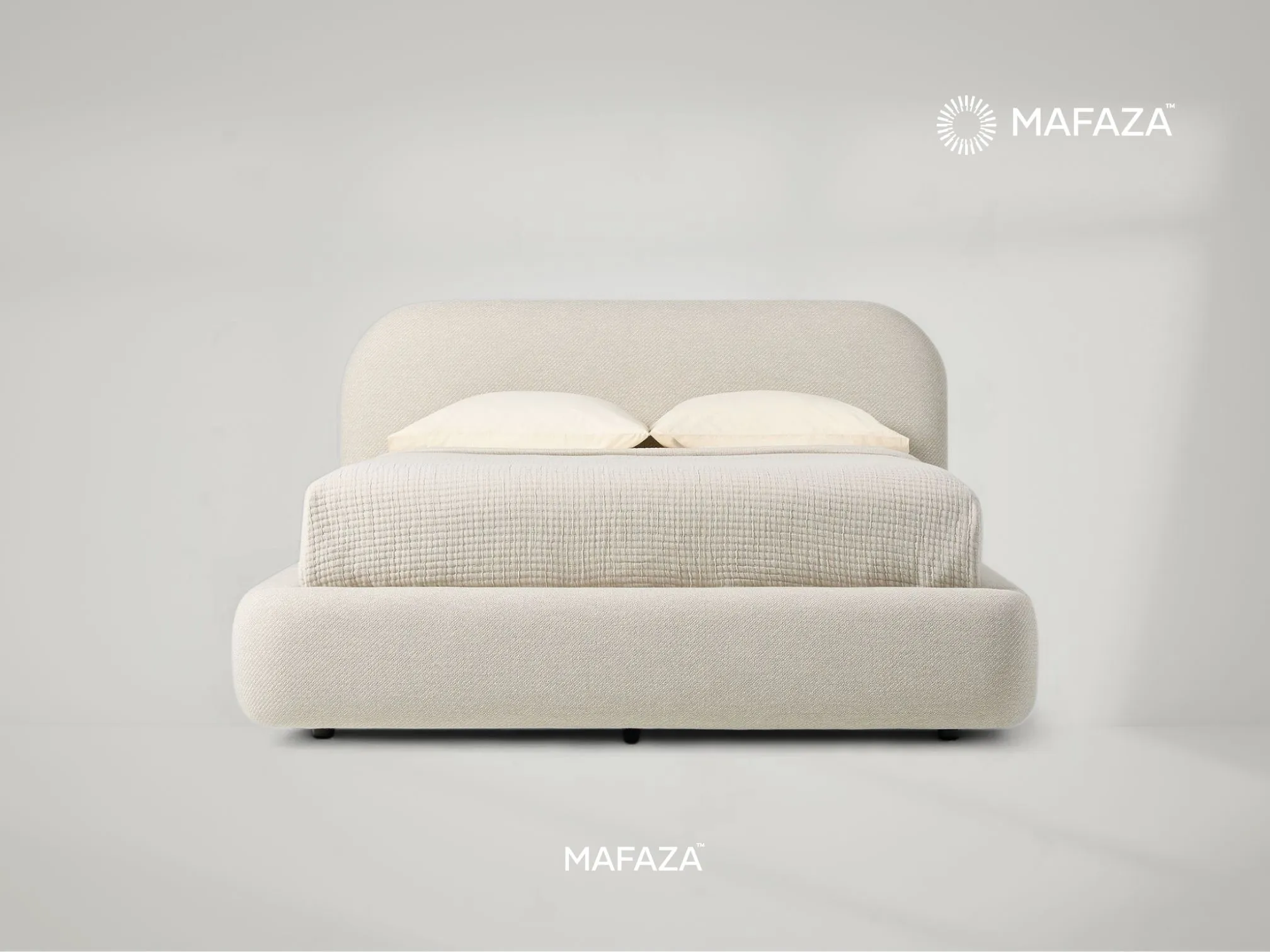 Modern, cream upholstered storage bed frame with rounded corners and a curved headboard. The mattress platform is shown fully lifted via a black metal hydraulic mechanism, revealing the full under-bed storage space. Constructed from Certified Teak Wood an