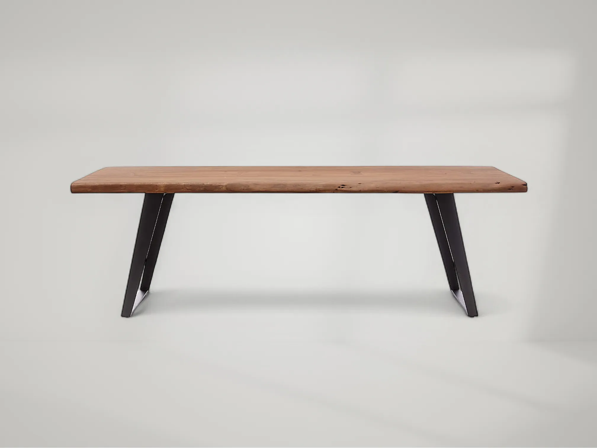 Yukon solid teak dining table featuring strong form and rustic natural appeal by Mafaza Living